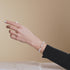 St. Amanda | .925 Sterling Silver | Alabaster Firefly Glass x Ivory Freshwater Pearl Cross Bracelet